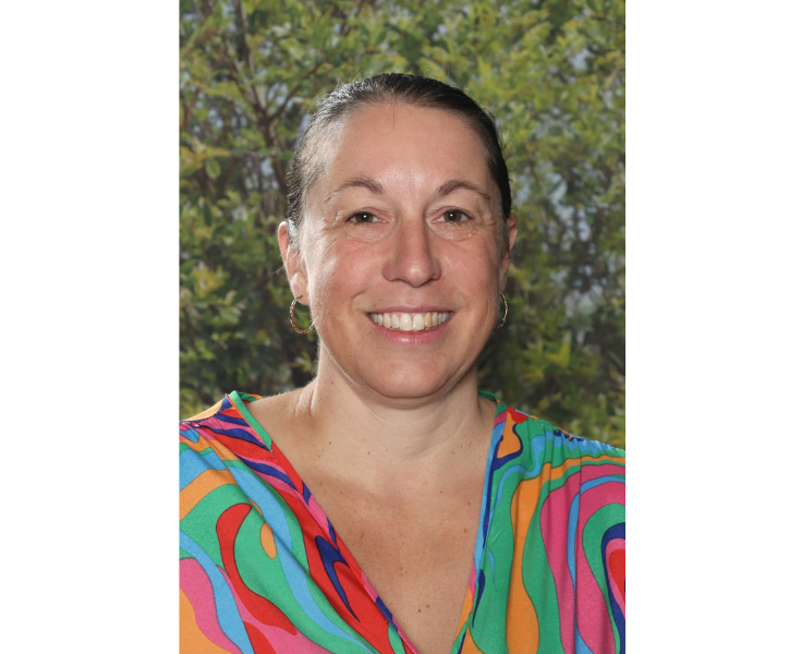 Female staff member smiling to camera