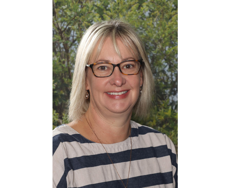 Female staff member smiling to camera