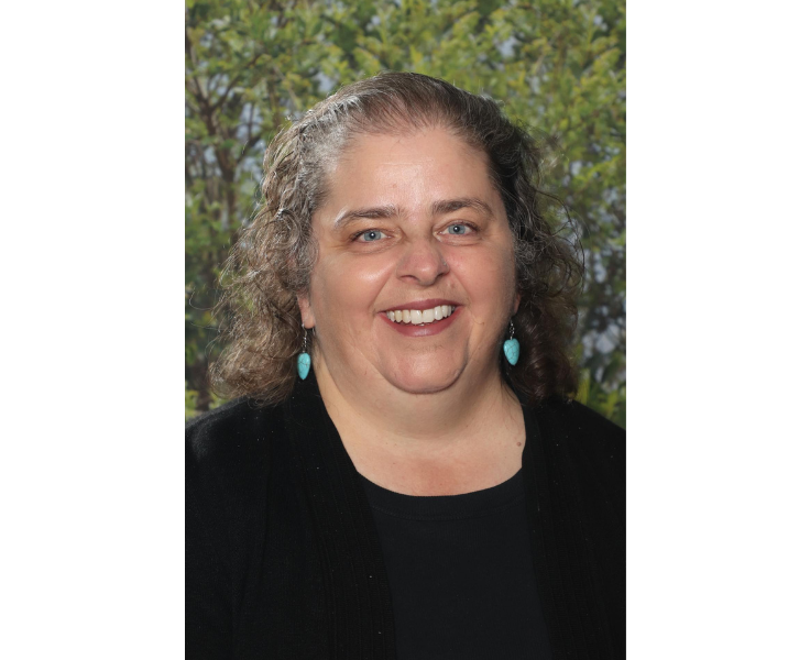 Female staff member smiling to camera